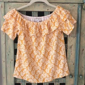 Yellow and white print off shoulder shirt.